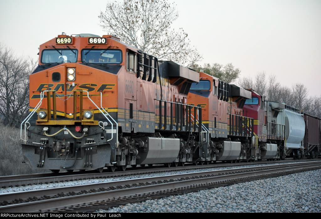 Paused westbound manifest waits in the siding